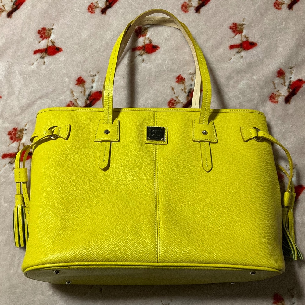 Dooney & Bourke beautiful yellow bag with red interior,  side tassels, preowned